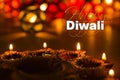 Happy diwali - diwali greeting card with illuminated diya