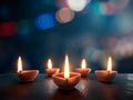 Lit diya lamp on an abstract background with shallow depth of field