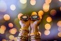 Happy Diwali - Woman hands with henna holding lit candle isolated on dark background. Clay Diya lamps lit during Dipavali, Hindu Royalty Free Stock Photo