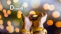 Happy Diwali - Woman hands with henna holding lit candle isolated on dark background. Clay Diya lamps lit during Dipavali, Hindu Royalty Free Stock Photo