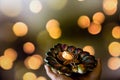 Happy Diwali - Woman hands with henna holding lit candle isolated on dark background. Clay Diya lamps lit during Dipavali, Hindu Royalty Free Stock Photo