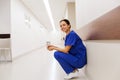 Happy doctor or nurse at hospital corridor Royalty Free Stock Photo