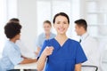 Happy doctor over group of medics at hospital Royalty Free Stock Photo