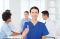 Happy doctor over group of medics at hospital Royalty Free Stock Photo