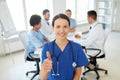 Happy doctor over group of medics at hospital Royalty Free Stock Photo