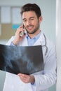 happy doctor on phone with xray Royalty Free Stock Photo
