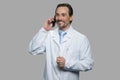 Happy doctor or scientist talking on cell phone.