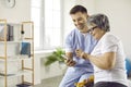 Happy doctor and senior woman using a modern health monitoring app on a mobile phone Royalty Free Stock Photo