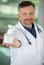 happy doctor showing hand sanitizer Royalty Free Stock Photo