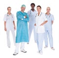 Happy Doctor In Surgical Gown With His Coworkers