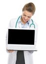 Happy doctor woman looking in laptop blank screen Royalty Free Stock Photo