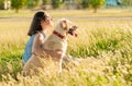 Happy dog and owner enjoying nature in the park