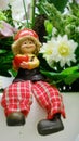 Happy doll in the flower garden