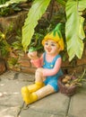 Happy doll in a garden Royalty Free Stock Photo