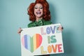 Happy drag queen holding gay pride banner - Lgbtq and concept - Focus on face Royalty Free Stock Photo