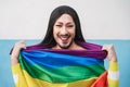 Happy drag queen wearing lgbt rainbow flag - Focus on face Royalty Free Stock Photo