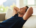 Happy dreams. a handsome young man resting on his sofa at home.