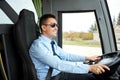 Happy driver driving intercity bus