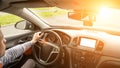 Happy driver inside car at sunset. Young man have fun ride trip travel on road in summer sunny day. Drive vacation concept Royalty Free Stock Photo