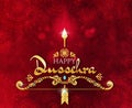 Happy Dussehra greeting card design in a deep textured red background with gold lettering and decoration celebrating the Royalty Free Stock Photo