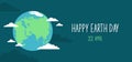 Happy Earth Day banner. Globe of the planet Earth with clouds around and typography on a dark blue background