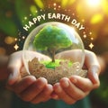 Happy earth day card with green tree in crystal ball held by hands Royalty Free Stock Photo