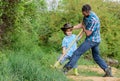 Happy earth day. Dig grounf with shovel. rich natural soil. Eco farm. Ranch. small boy child help father in farm. new Royalty Free Stock Photo