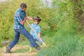 Happy earth day. Dig grounf with shovel. rich natural soil. Eco farm. Ranch. small boy child help father in farm. new Royalty Free Stock Photo