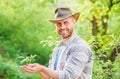 Happy earth day. Eco living. farming and agriculture cultivation. Gardening. muscular ranch man in cowboy hat care Royalty Free Stock Photo