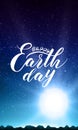 Happy Earth Day lettering on abstract vector background with mountain landscape and rising sun. Royalty Free Stock Photo