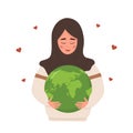 Happy Earth day. Smiling arabian girl holding Planet with care and love. Caring for Nature and environment. Concept of Royalty Free Stock Photo