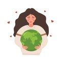 Happy Earth day. Smiling girl holding Planet with care and love. Caring for Nature and environment. Concept of Royalty Free Stock Photo