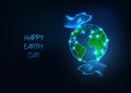 Happy Earth Day web banner with futuristic glowing low polygonal planet globe and caring human hands Royalty Free Stock Photo