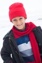 Happy East Indian boy playing in the snow