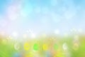 Happy easter background. Abstract green meadow with spring flowers and colorful easter eggs and a sunny blue sky. Space for your