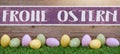 HAPPY EASTER background panorama greeting card - Many pastel painted dotted Easter eggs on fresh green meadow grasses and rustic
