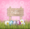 Happy Easter background with realistic 3d colorful eggs, wooden sign, and daisy flowers on pink backdrop Royalty Free Stock Photo