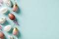 Happy Easter banner design. Elegant Easter eggs, decorative bunnies, flowers on pastel blue background. Flat lay, top view, copy Royalty Free Stock Photo