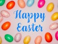 Happy Easter Banner with multiple coloured Easter eggs on a pink background Royalty Free Stock Photo