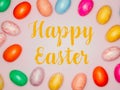 Happy Easter Banner with multiple coloured Easter eggs on a pink background Royalty Free Stock Photo