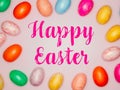 Happy Easter Banner with multiple coloured Easter eggs on a pink background Royalty Free Stock Photo