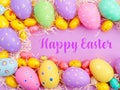 Happy Easter Banner with multiple coloured Easter eggs surrounded by straw Royalty Free Stock Photo