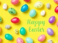 Happy Easter Banner with multiple coloured Easter eggs on a Yellow background Royalty Free Stock Photo