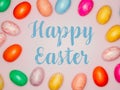 Happy Easter Banner with multiple coloured Easter eggs on a pink background Royalty Free Stock Photo