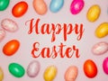 Happy Easter Banner with multiple coloured Easter eggs on a pink background Royalty Free Stock Photo