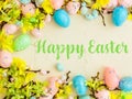 Happy Easter Banner with multiple coloured Easter eggs surrounded by spring flowers Royalty Free Stock Photo