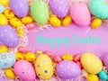 Happy Easter Banner with multiple coloured Easter eggs surrounded by straw Royalty Free Stock Photo