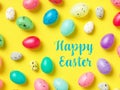 Happy Easter Banner with multiple coloured Easter eggs on a Yellow background Royalty Free Stock Photo
