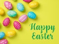 Happy Easter Banner with multiple coloured Easter eggs on a Yellow background Royalty Free Stock Photo