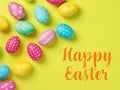 Happy Easter Banner with multiple coloured Easter eggs on a Yellow background Royalty Free Stock Photo